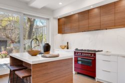 kitchen with island and red stove