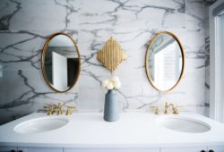 bathroom vanity with two oval mirrors