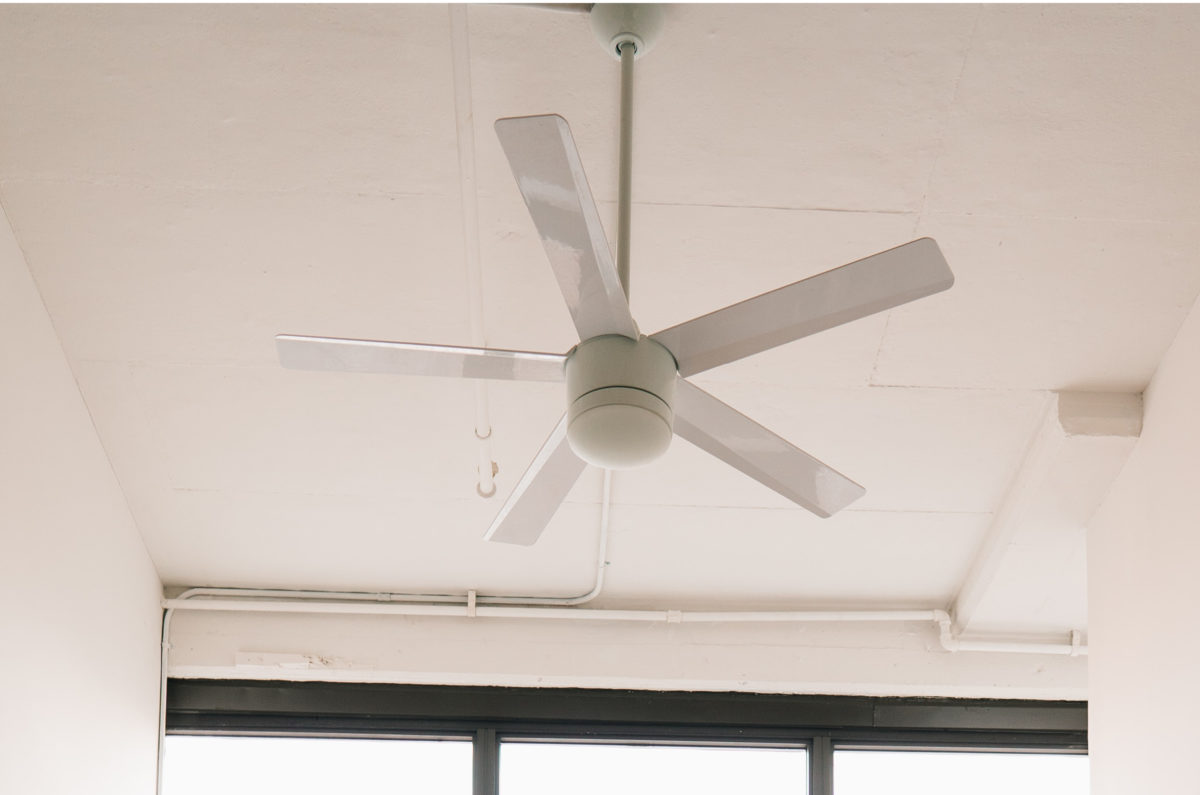 ceiling fan above a multi-paned window